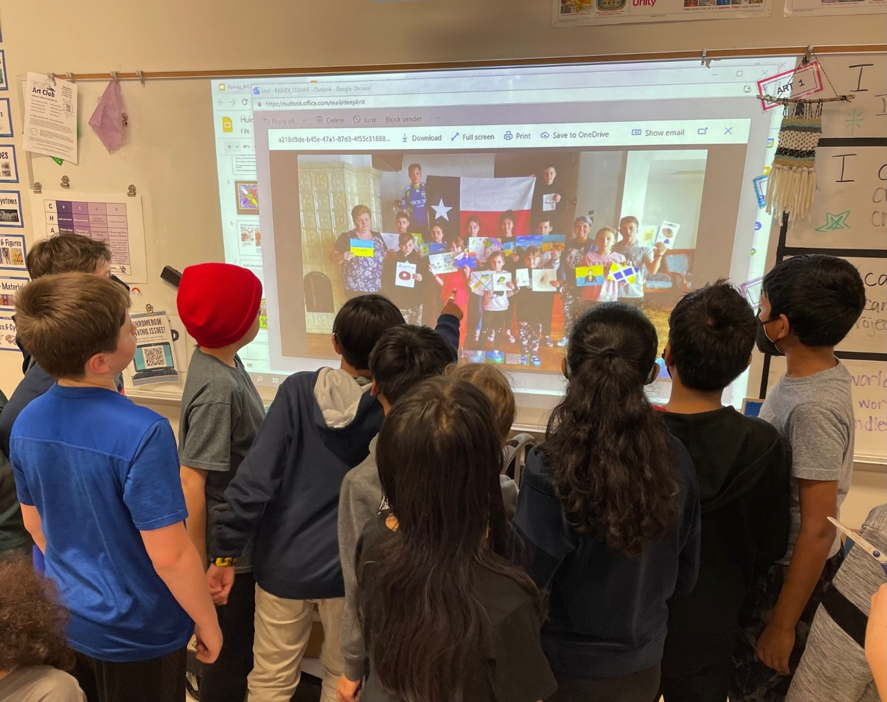 Vandeventer students look at their artwork that has travelled the world
